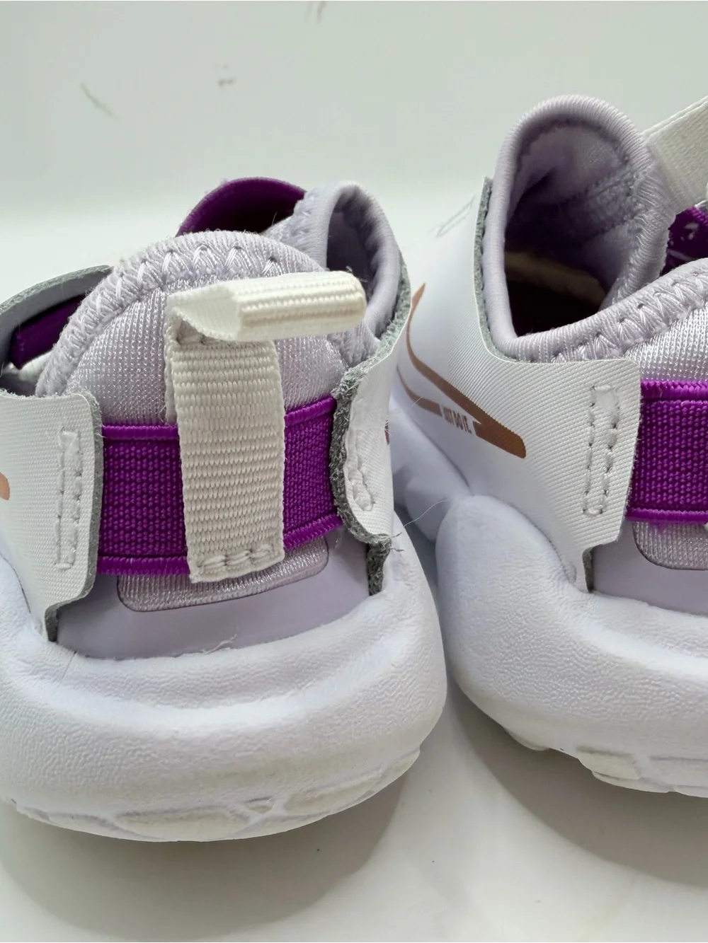 Nike Kids White Sneakers with Purple Strap and Gold Swoosh
